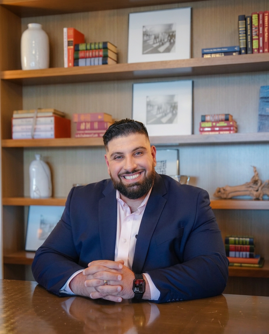 Bajis Awawdeh smiling at his desk