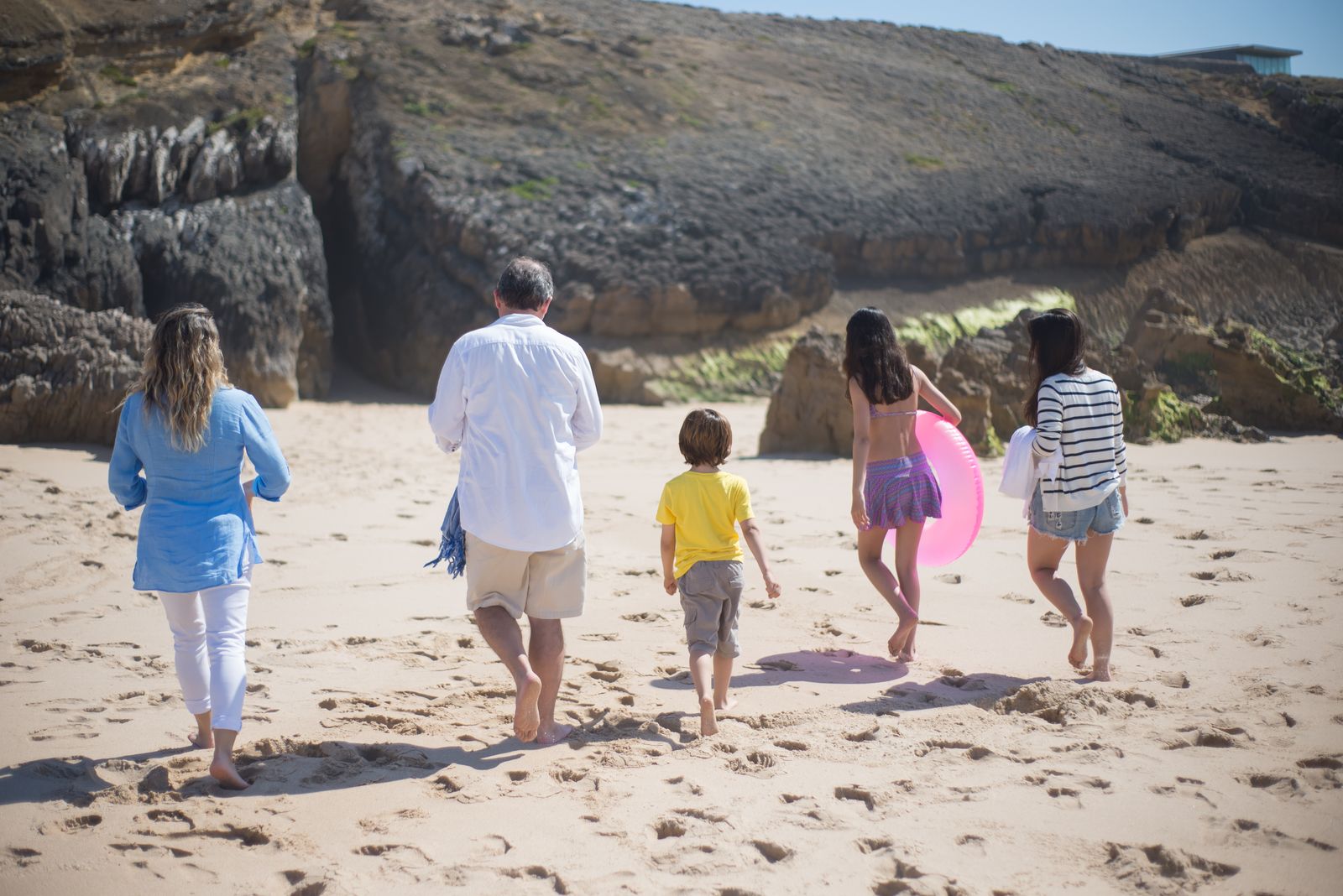 A family walking together on a beach